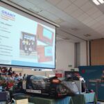 Aula główna PANS poda czas pokazu na ekranie prezentacja koła Granit